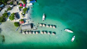 created by dji camera aerial view of beach huts sitting on a sandbar in crystal clear waters off the coast of cartagena colombia