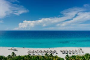 The most beautiful species in the Atlantic Ocean and beach with umbrellas in the resort of Varadero, Cuba